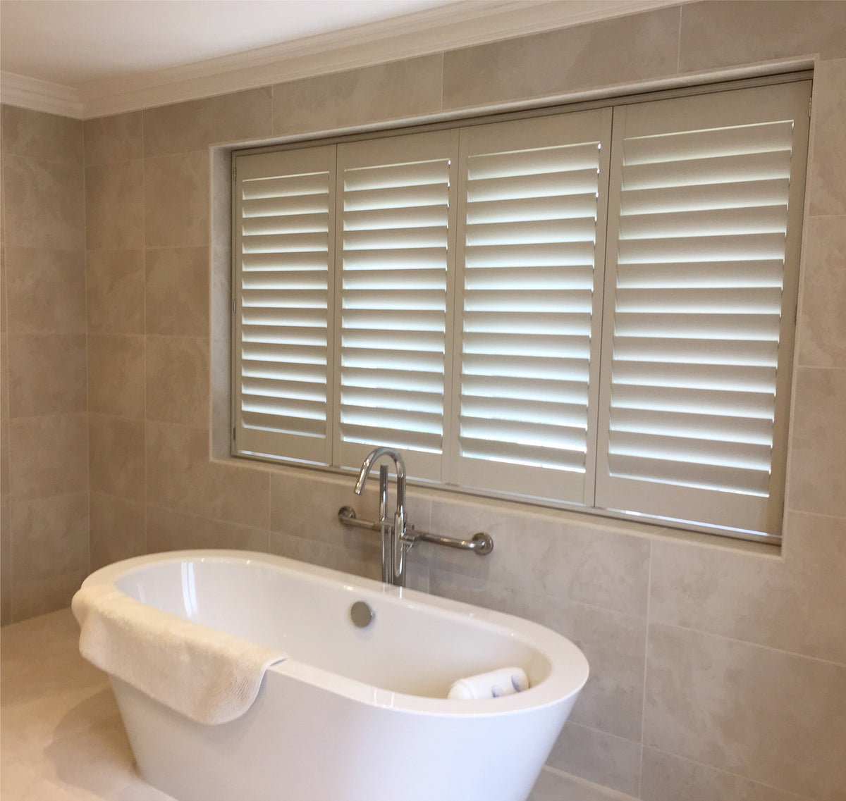 Tier-on-tier shutters fitted in a Buckinghamshire bathroom