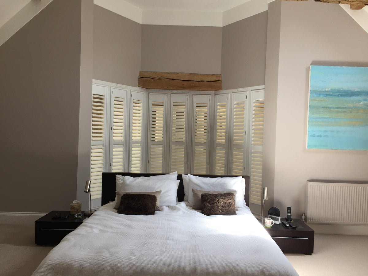 Full Height shutters fitted across a bedroom bay window in Hampshire