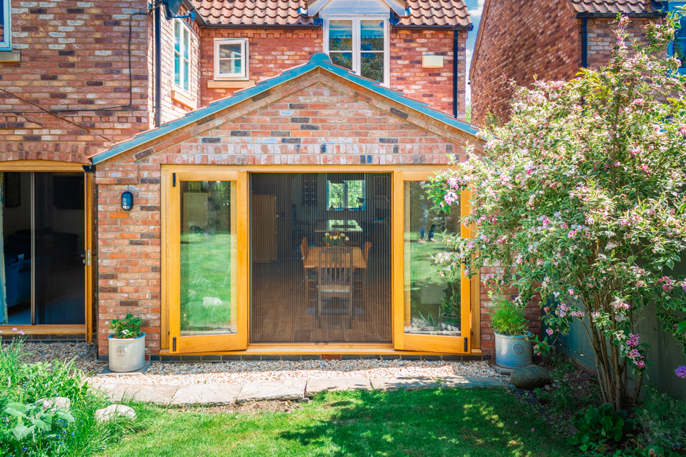 Distinction pleated insect screen fitted across large garden doors