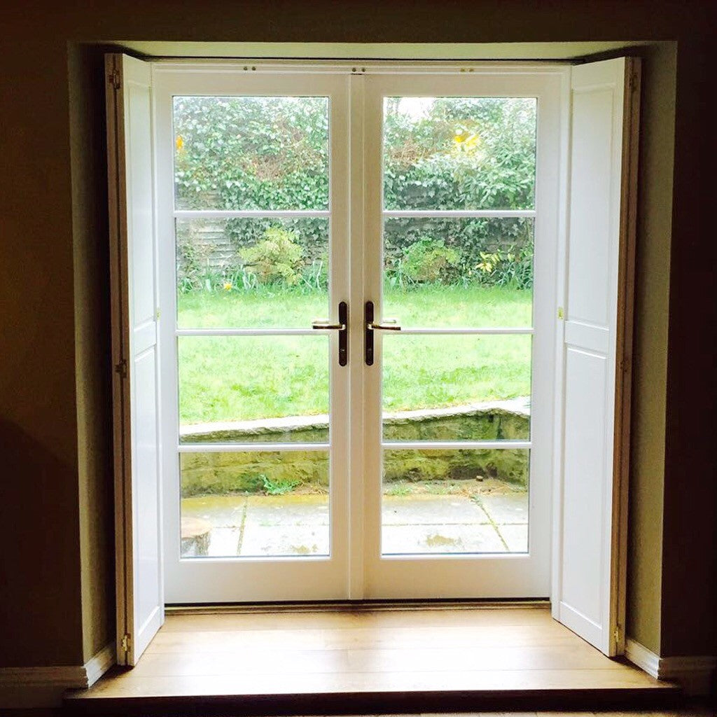 Tracked shutters fitted across a wide Oxfordshire opening