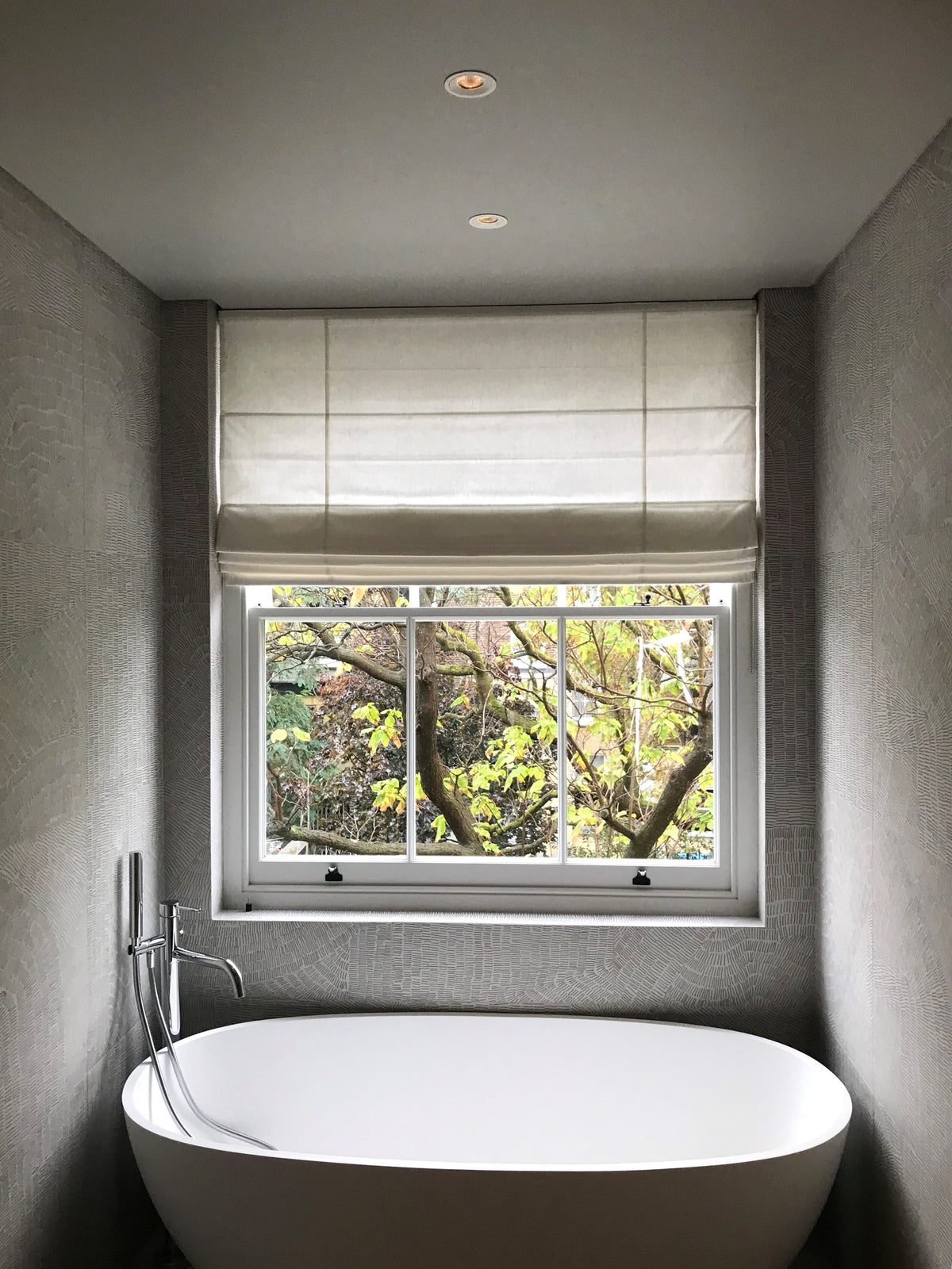 Made-to-measure Roman blind fitted above a bathroom window
