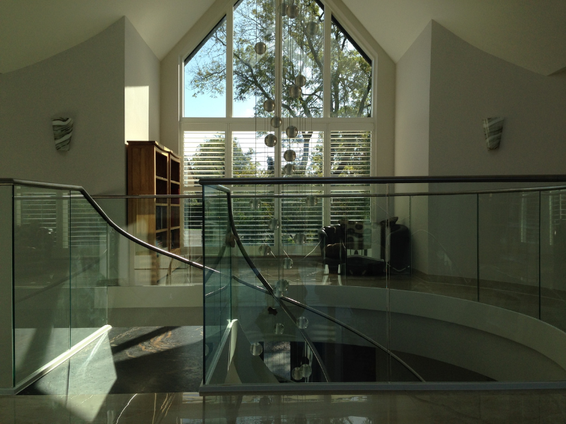 Bespoke lower-half shutters preserving light on a Beaconsfield landing