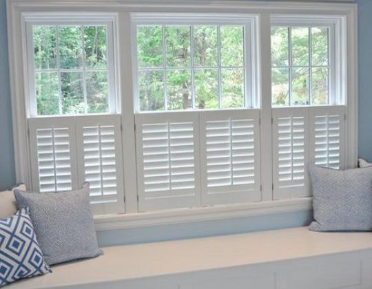 Café style plantation shutters in a living room
